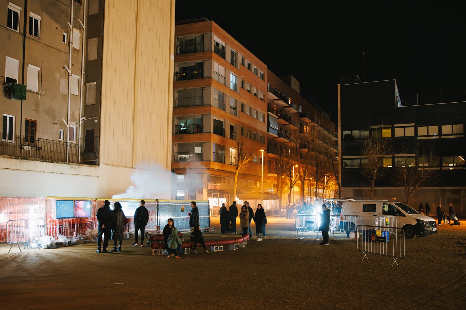 The excavation site at night, barriers, smoke and the light bar